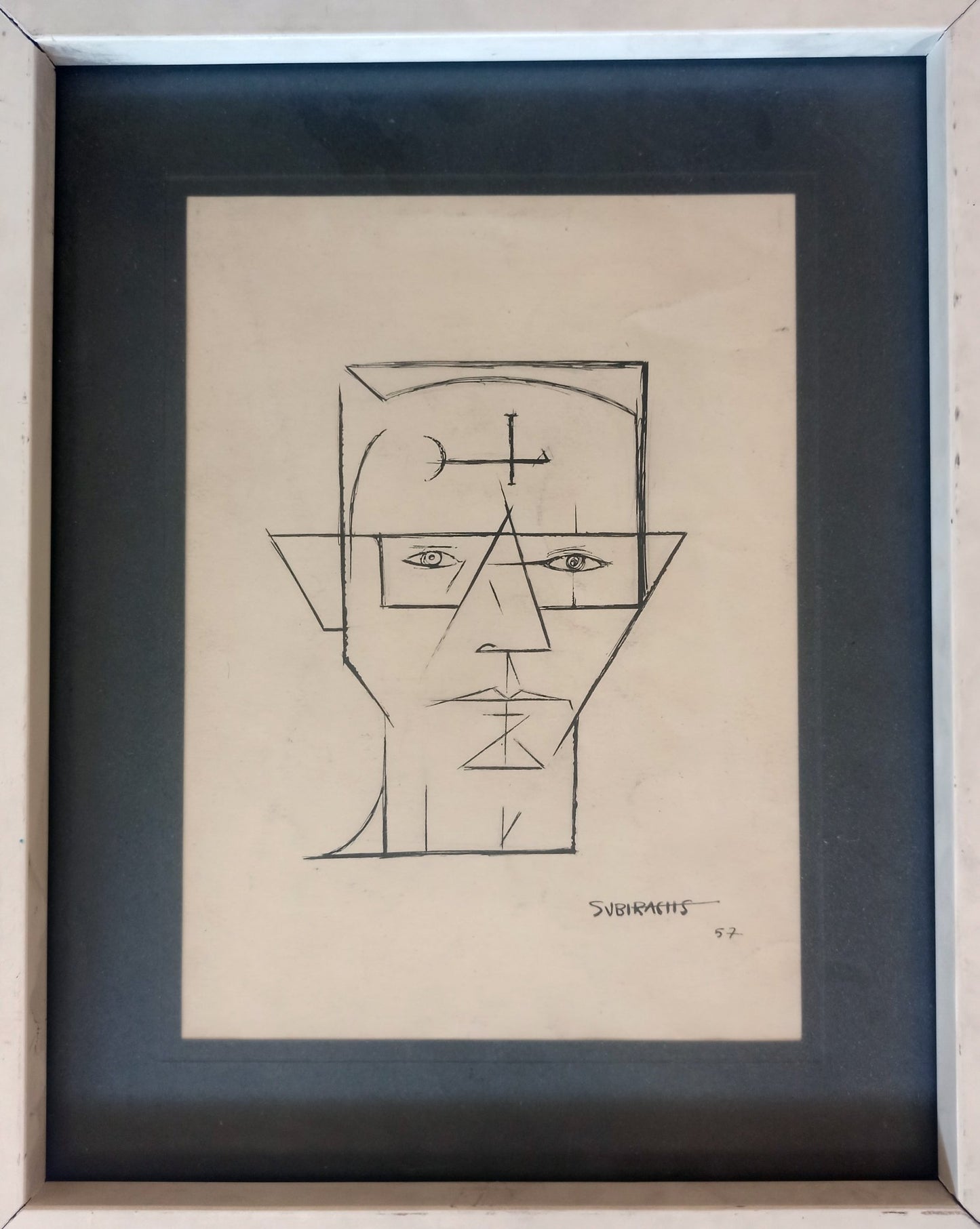 Dibujo a tinta de Subirachs con figuras geométricas abstractas en una cara y rostro lineal en la otra, sobre papel obra enmarcada