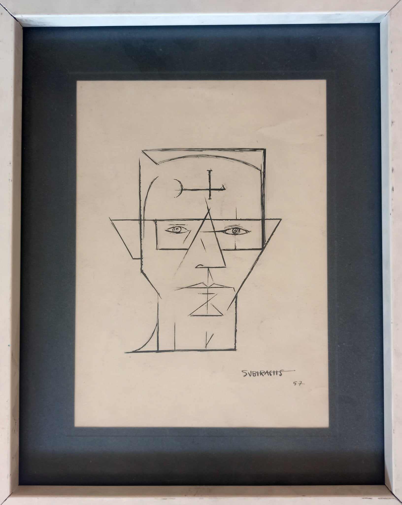 Dibujo a tinta de Subirachs con figuras geométricas abstractas en una cara y rostro lineal en la otra, sobre papel obra enmarcada